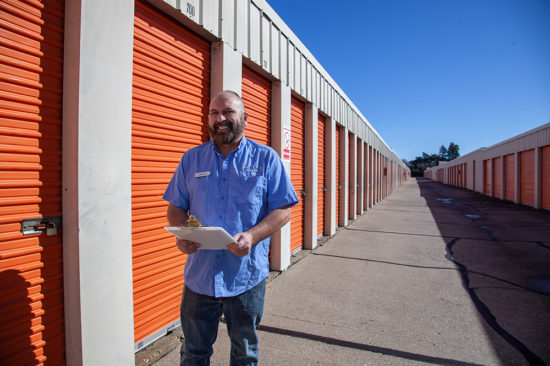 customer-service-robert Service representative in front of the orange storage containers