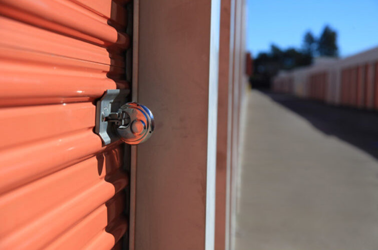 photo of padlock on orange storage container door